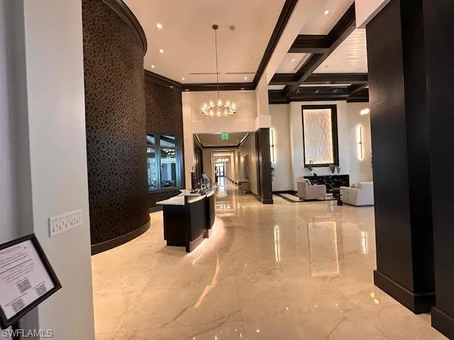 a view of a livingroom with furniture and a ceiling fan