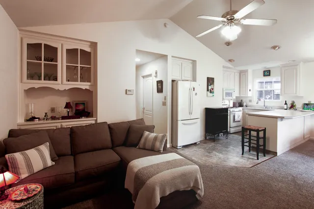 a kitchen that has a sink and a stove in it