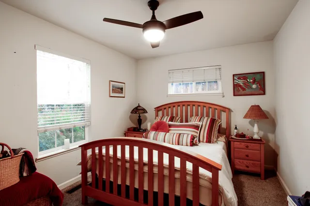 a bedroom with windows