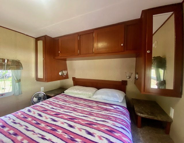 17-100 Woodhaven Sublette, IL 61367 - Photo 8 of 11 a bedroom with a bed and a potted plant