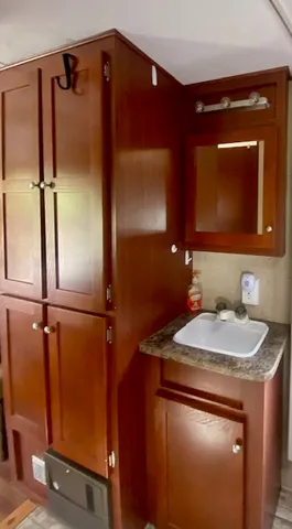 a bathroom with a sink and a mirror