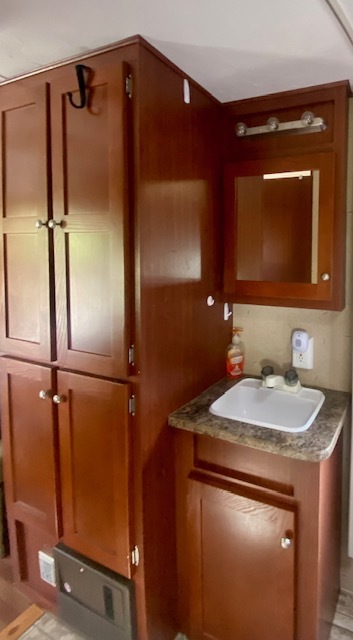 17-100 Woodhaven Sublette, IL 61367 - Photo 10 of 11 a bathroom with a sink and a mirror