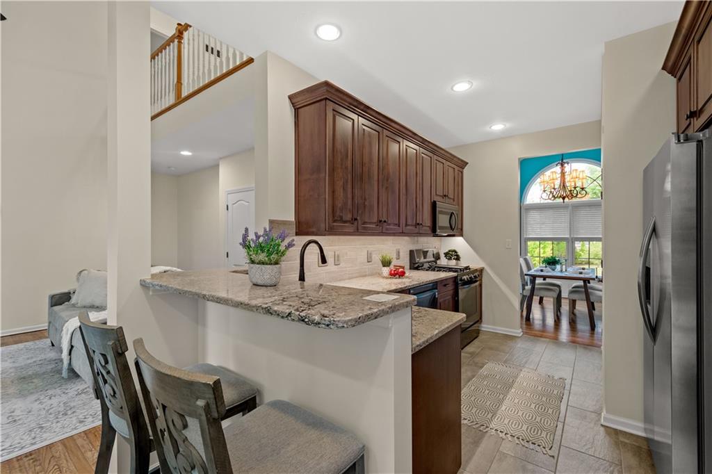 2510 Hilltop Road Presto, PA 15142 - Photo 12 of 36 a kitchen with stainless steel appliances granite countertop sink stove top oven and cabinets