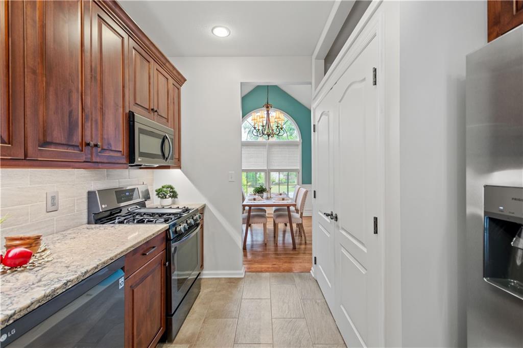 2510 Hilltop Road Presto, PA 15142 - Photo 14 of 36 a kitchen with stainless steel appliances granite countertop a stove a sink and a refrigerator