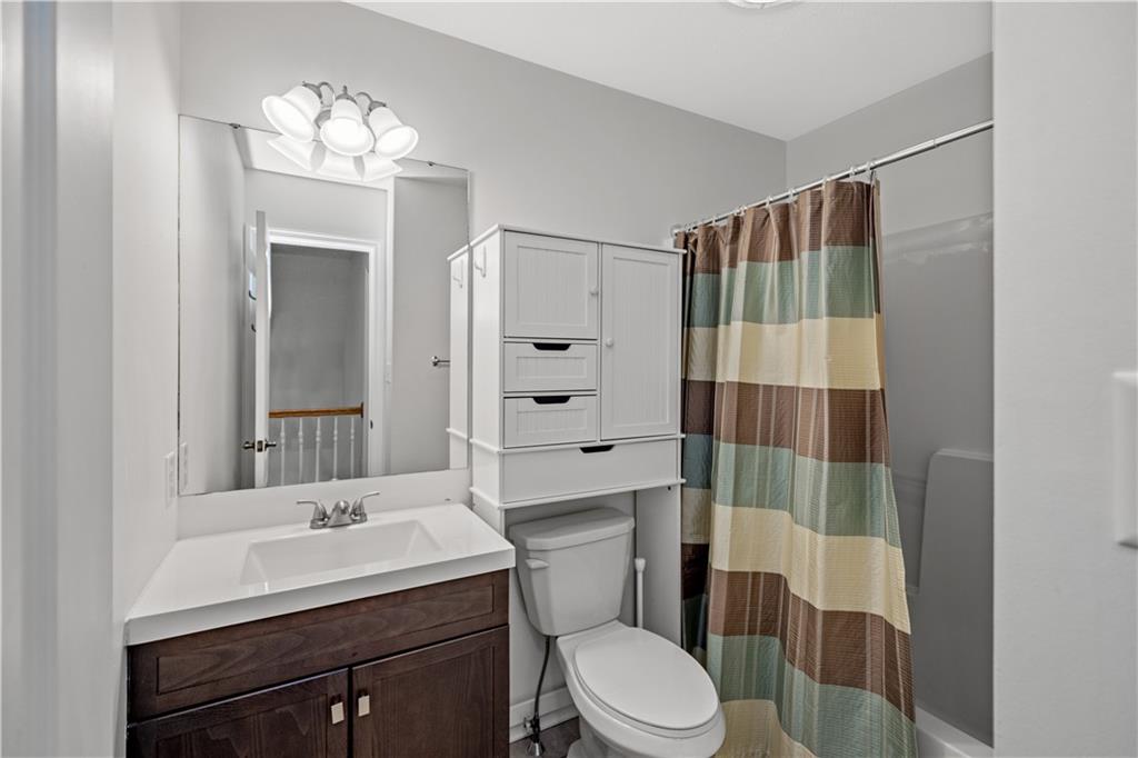 2510 Hilltop Road Presto, PA 15142 - Photo 22 of 36 a bathroom with a sink a toilet a mirror and shower