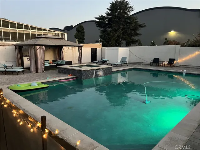 a view of a house with swimming pool