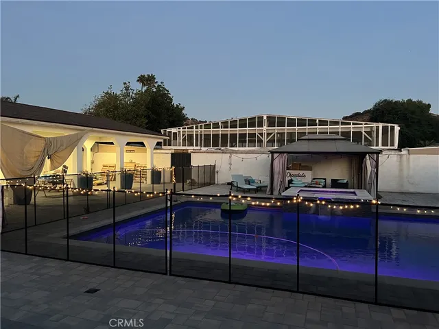 a bathroom with a tub shower and a window