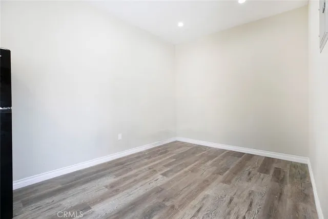 a living room with furniture window and wooden floor