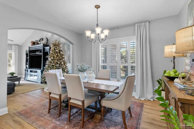 a view of a dining room with furniture window and outside view
