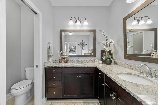a bathroom with a toilet and a sink