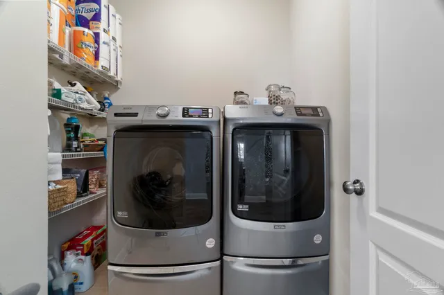 a work room with furniture and a chandelier