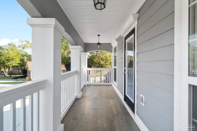 a view of a wooden deck and chairs