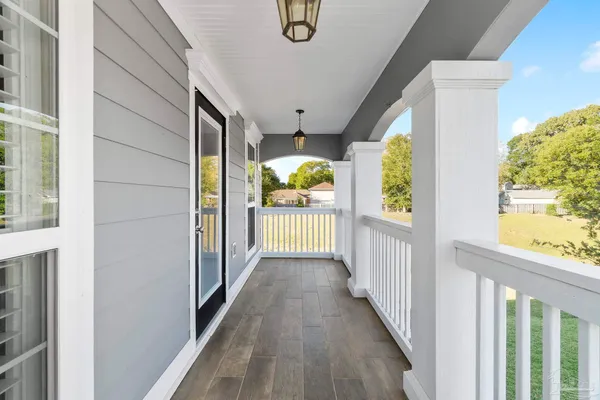 a large kitchen with stainless steel appliances kitchen island granite countertop a sink and cabinets