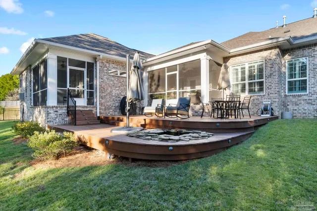a spacious bedroom with a bed and a chandelier