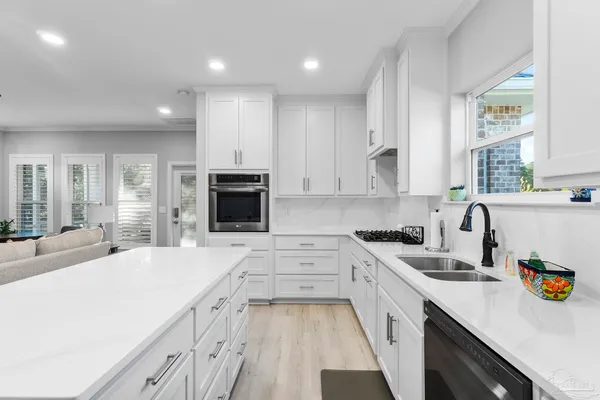a view of balcony with two chairs and a large window