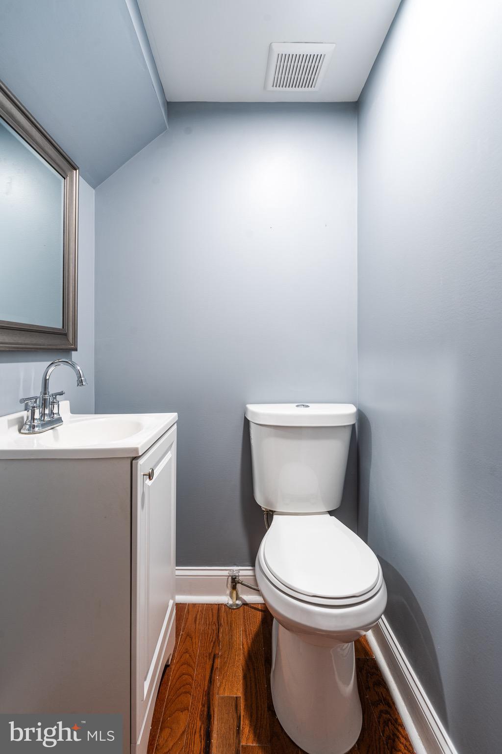 921 Eastern Avenue Baltimore, MD 21202 - Photo 17 of 23 a bathroom with a toilet sink and mirror
