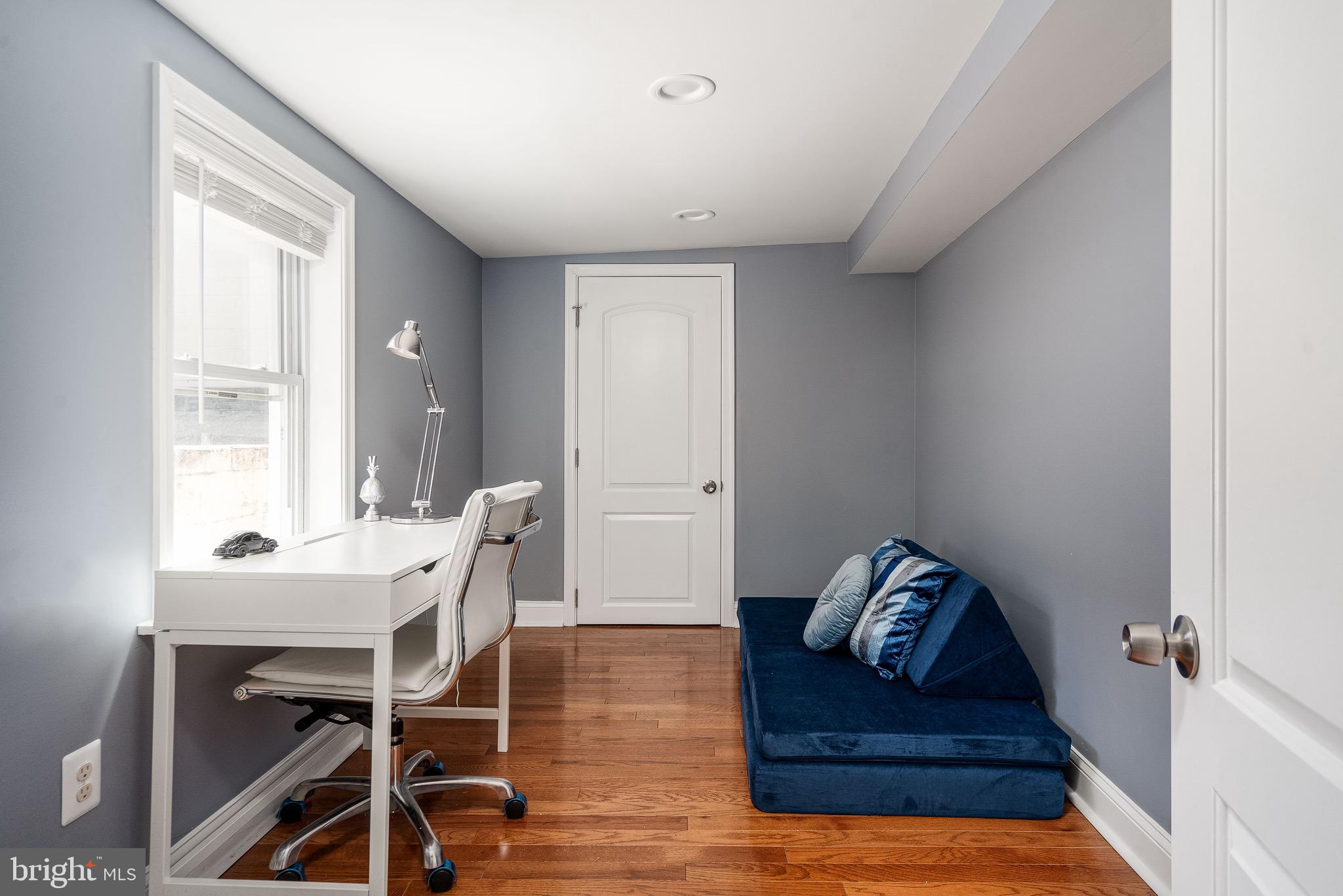 921 Eastern Avenue Baltimore, MD 21202 - Photo 23 of 23 a view of a livingroom with furniture and hardwood floor