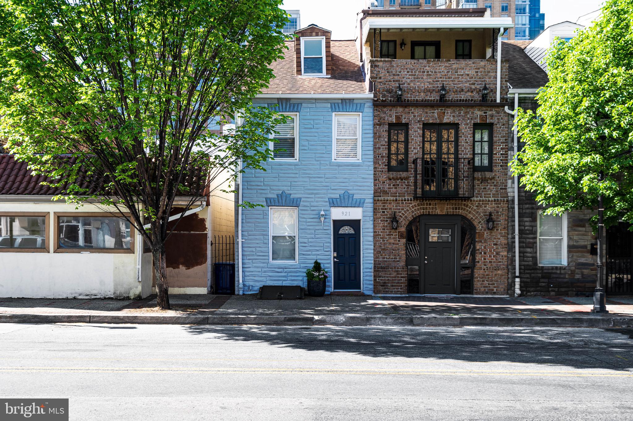 921 Eastern Avenue Baltimore, MD 21202 - Photo 3 of 23 a front view of a house with a yard