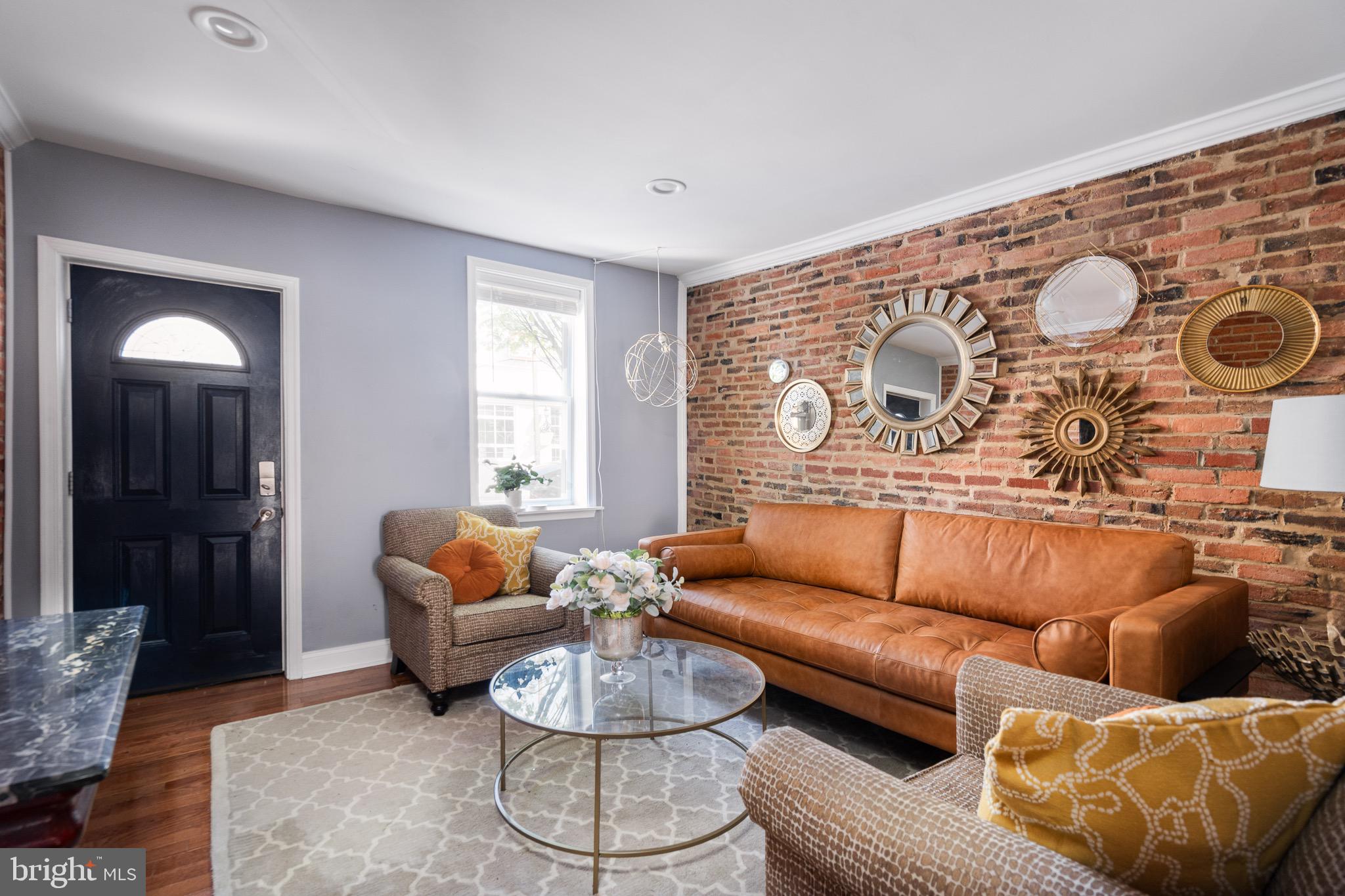 921 Eastern Avenue Baltimore, MD 21202 - Photo 4 of 23 a living room with furniture and a window