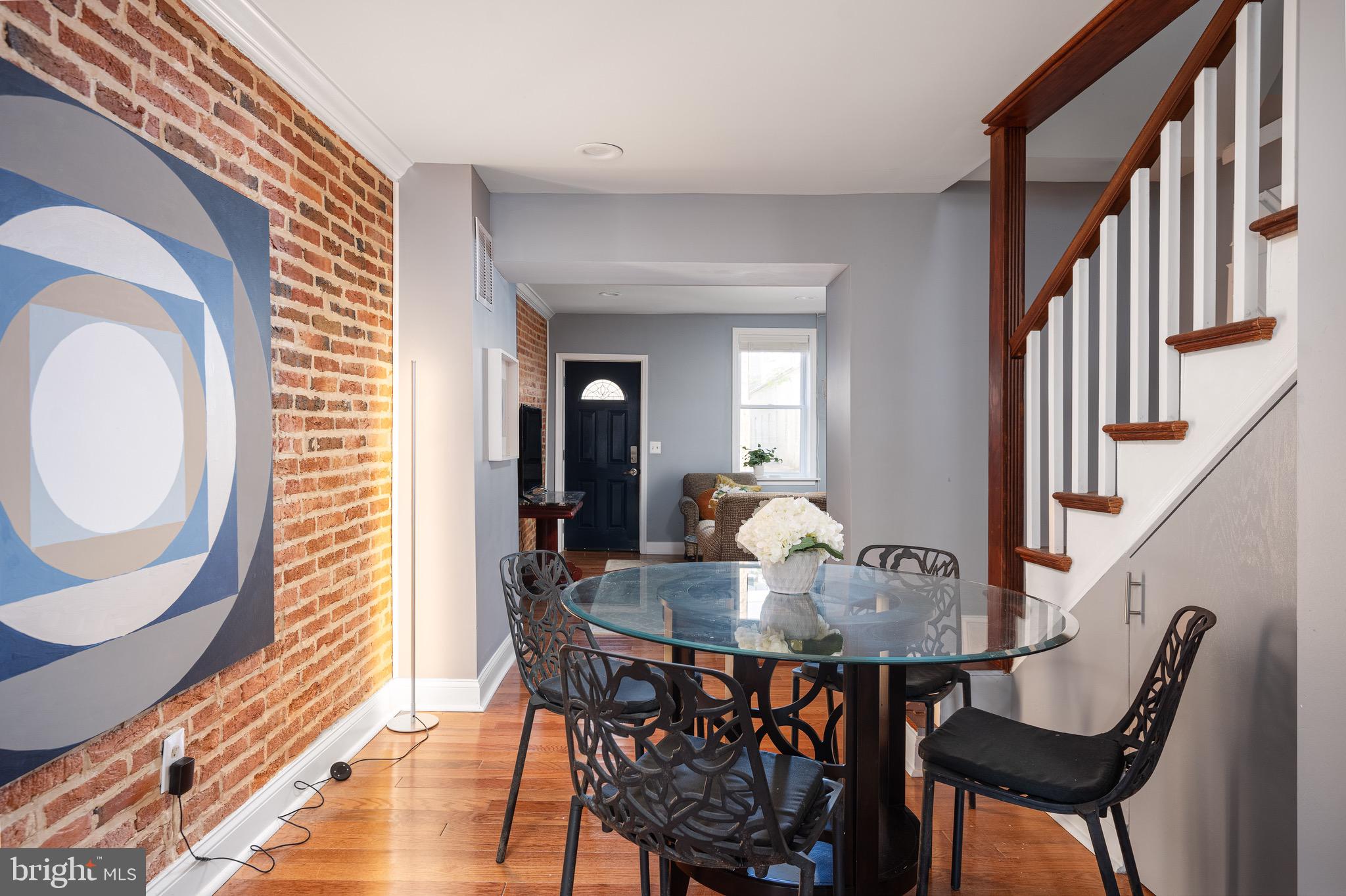 921 Eastern Avenue Baltimore, MD 21202 - Photo 5 of 23 a view of a dining room with furniture and wooden floor