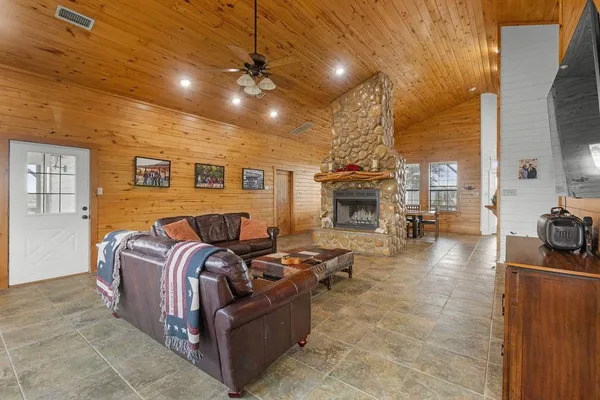 a view of a house with swimming pool and a yard