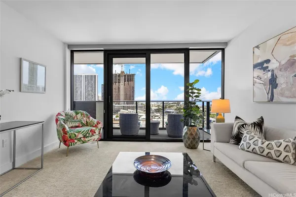 a living room with furniture and a large window