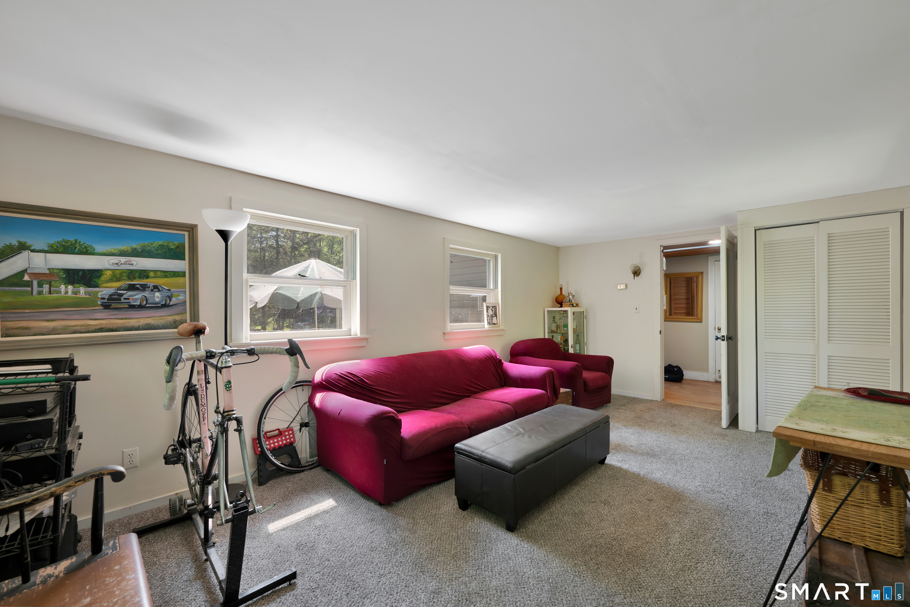 231 B Kent Road Kent, CT 06757 - Photo 13 of 35 a living room with furniture a window and gym equipment
