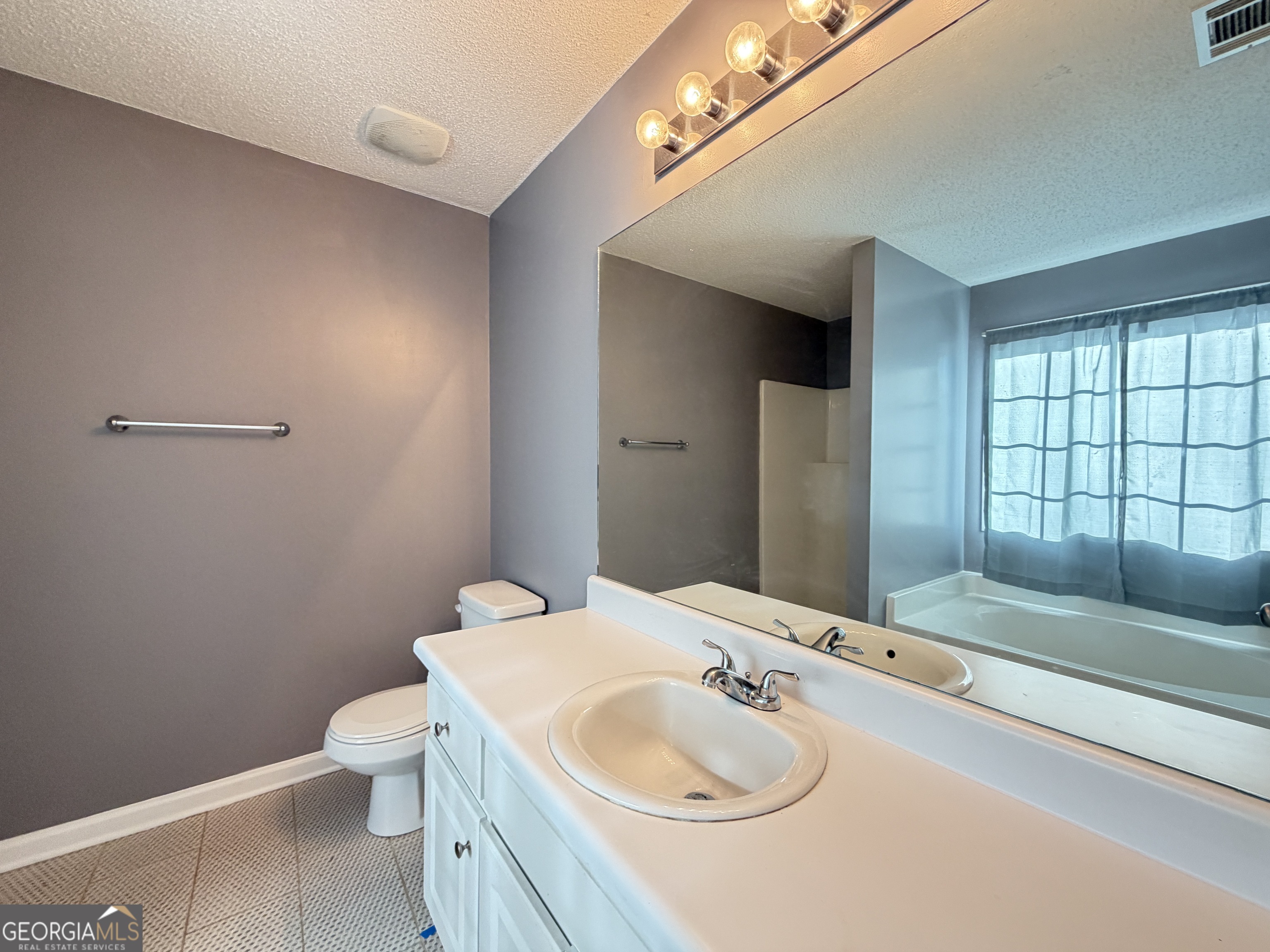 520 Redbud Lane Mount Airy, GA 30563 - Photo 15 of 26 a bathroom with a sink and a toilet