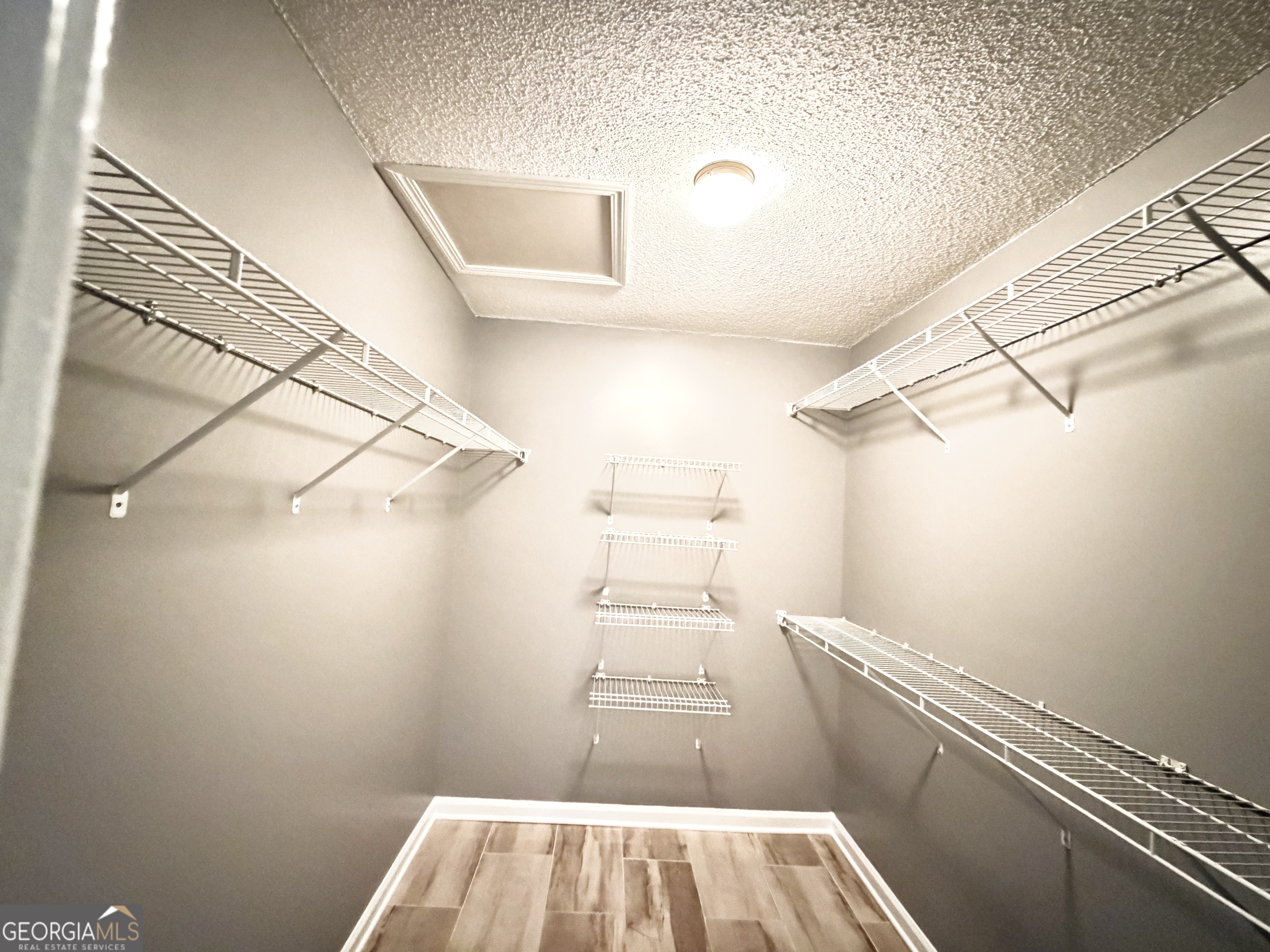 520 Redbud Lane Mount Airy, GA 30563 - Photo 17 of 26 a view of a room with racks on the wall