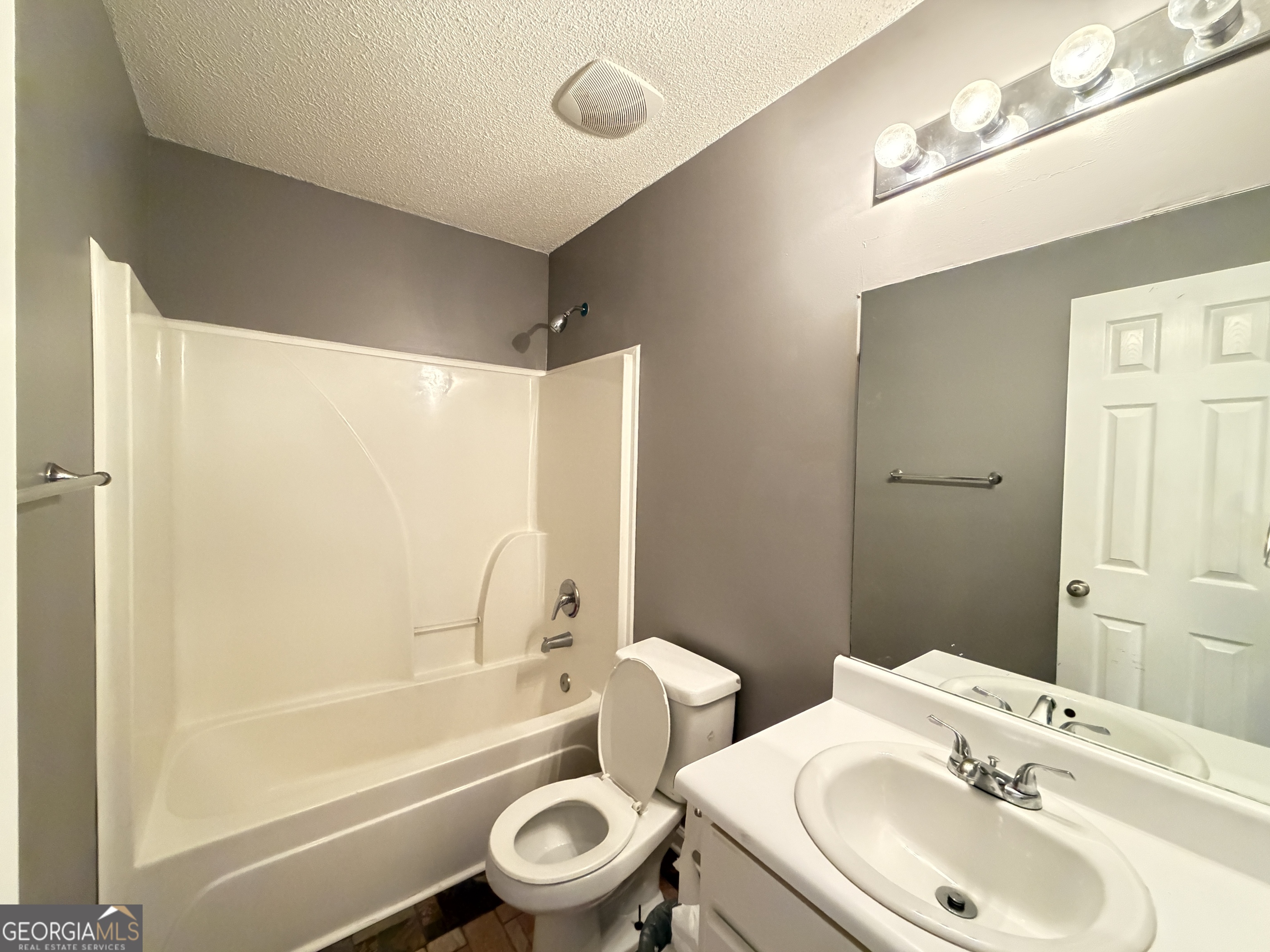 520 Redbud Lane Mount Airy, GA 30563 - Photo 20 of 26 a bathroom with a toilet sink and a bathtub