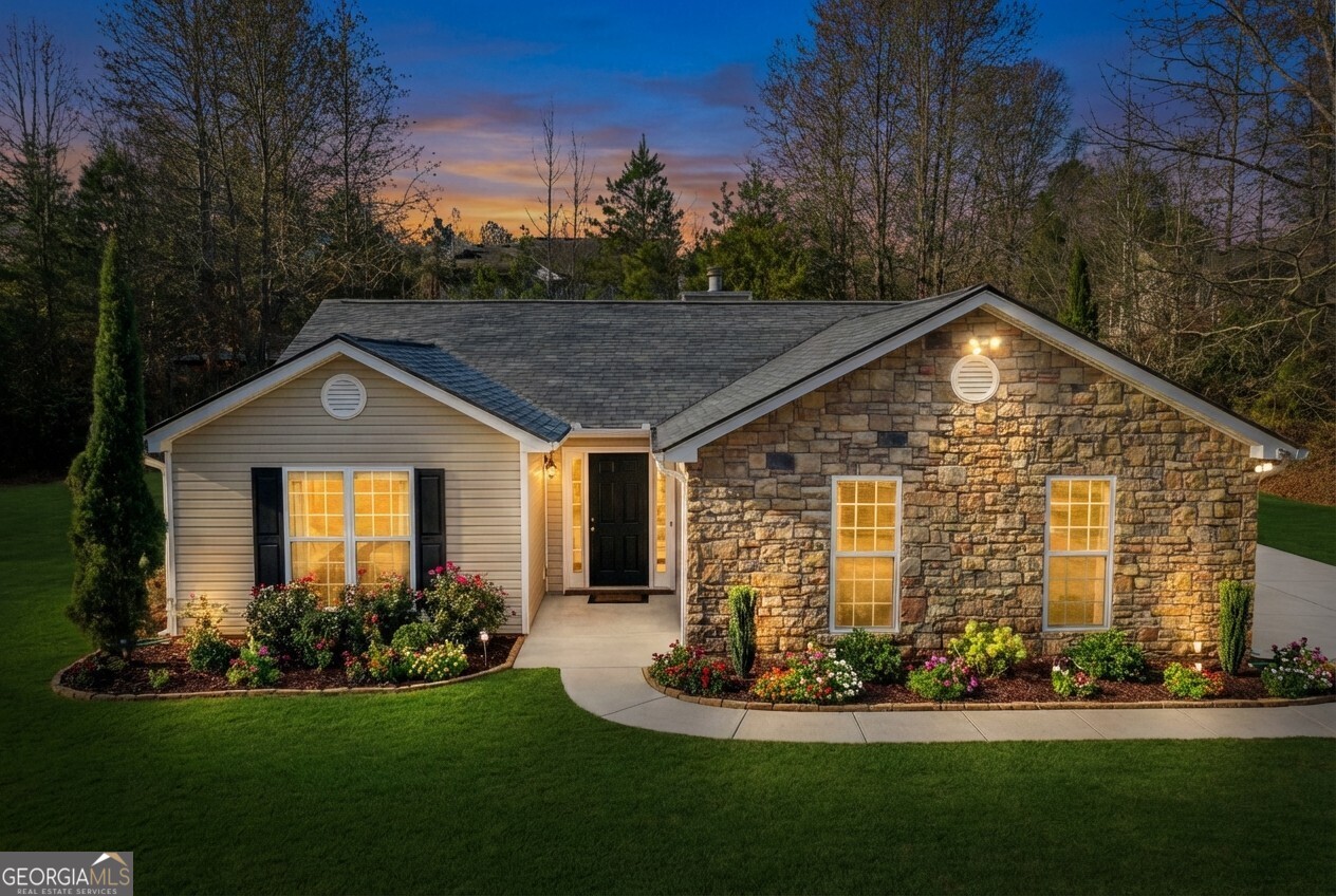 520 Redbud Lane Mount Airy, GA 30563 - Photo 2 of 26 a front view of house with yard and green space