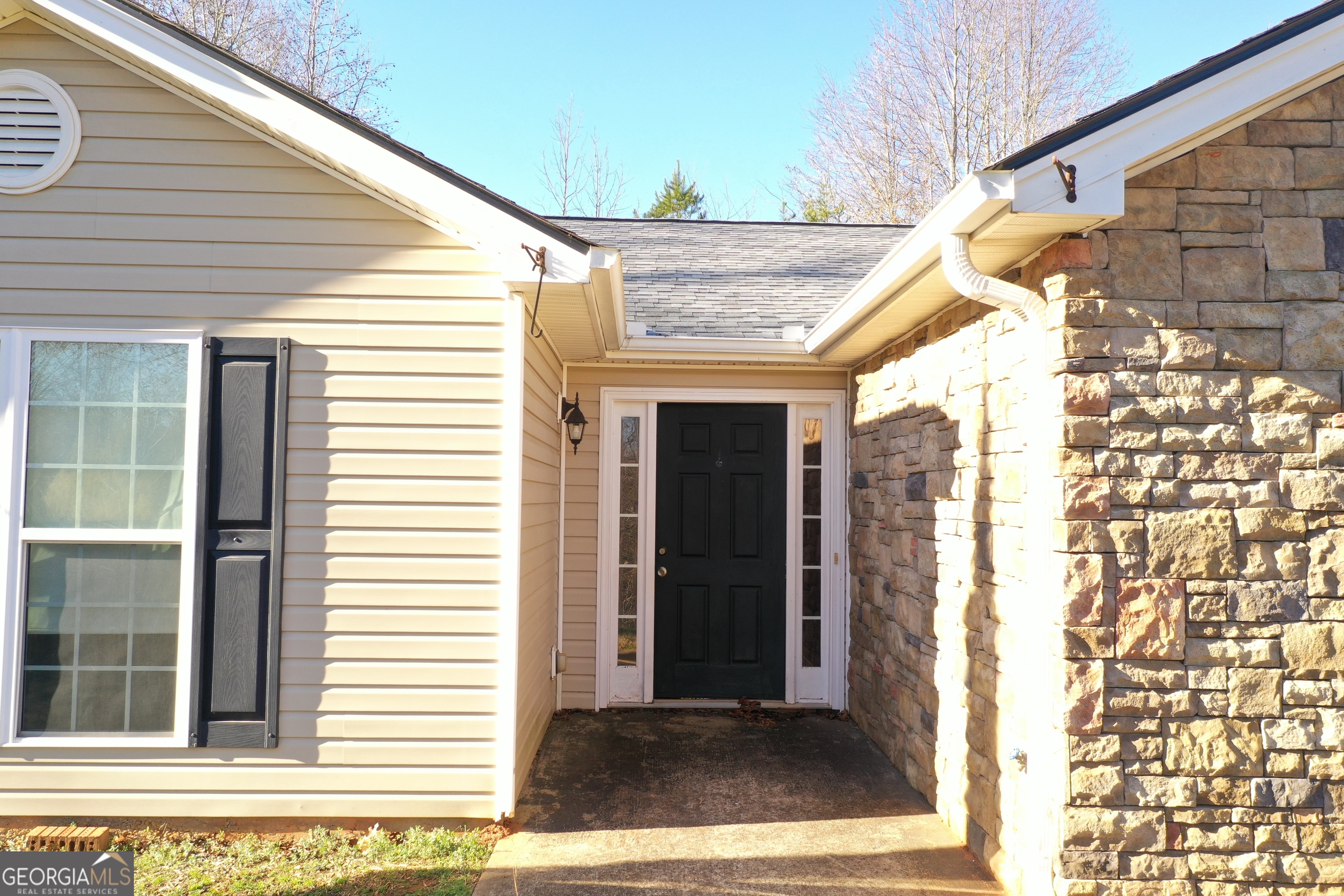520 Redbud Lane Mount Airy, GA 30563 - Photo 3 of 26 a view of a house with a door and wooden floor
