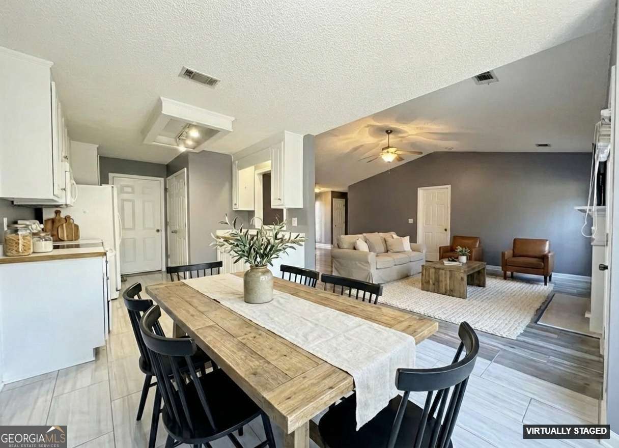 520 Redbud Lane Mount Airy, GA 30563 - Photo 9 of 26 a view of a dining room with furniture and wooden floor