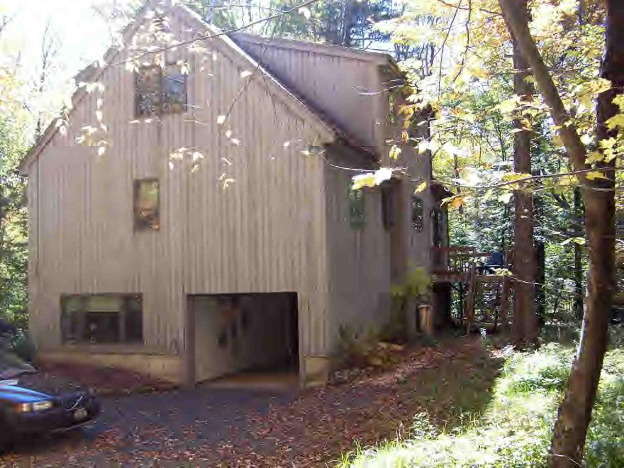 222 Thicket Road Tolland, MA 01034 - Photo 3 of 6 a view of a house with a backyard