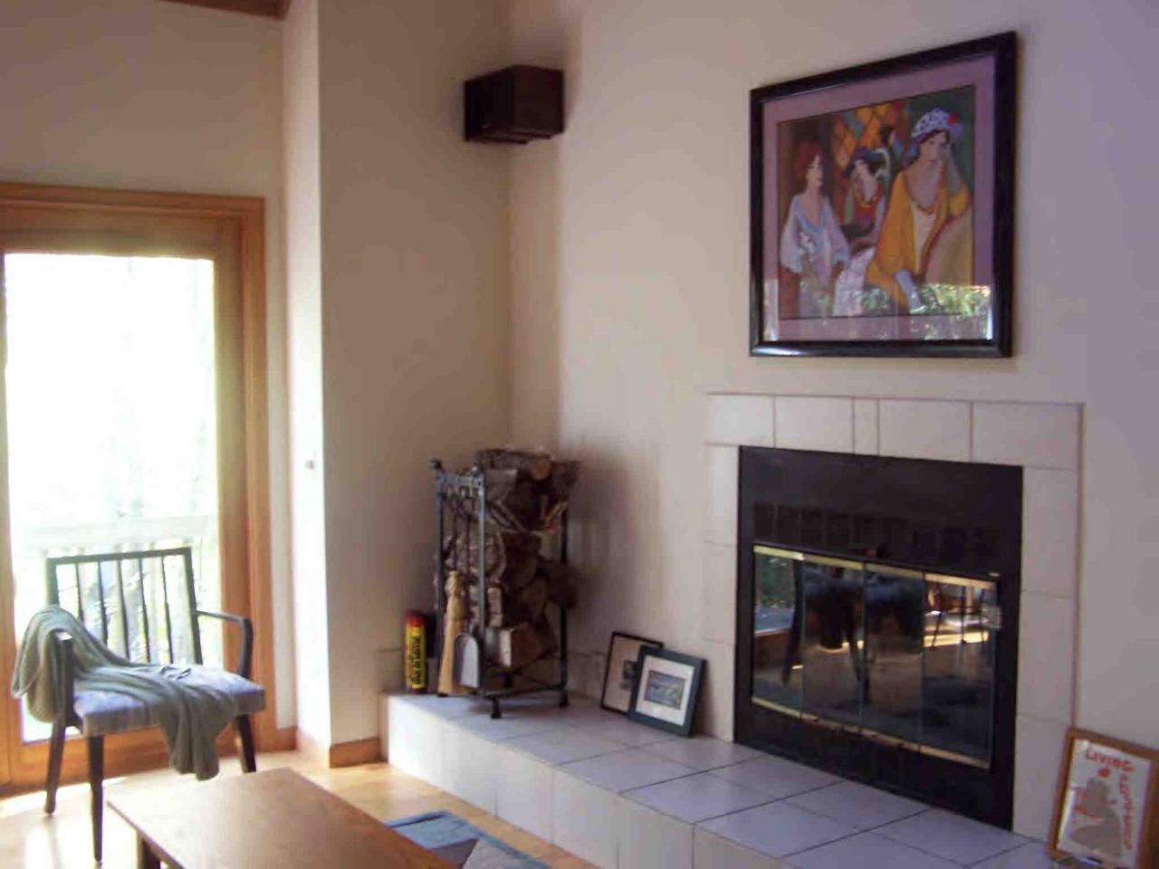 222 Thicket Road Tolland, MA 01034 - Photo 4 of 6 a view of a livingroom with furniture and a fireplace