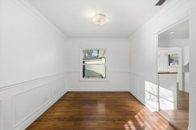 a kitchen with a refrigerator and a stove top oven
