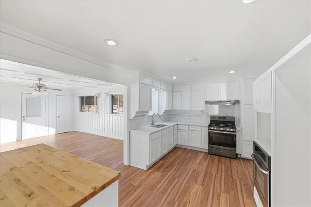 a kitchen with a refrigerator stove and oven