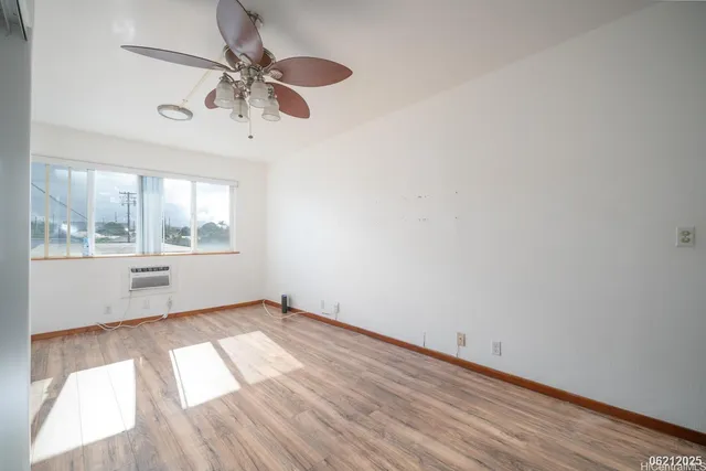 a view of a kitchen with wooden floor and a sink