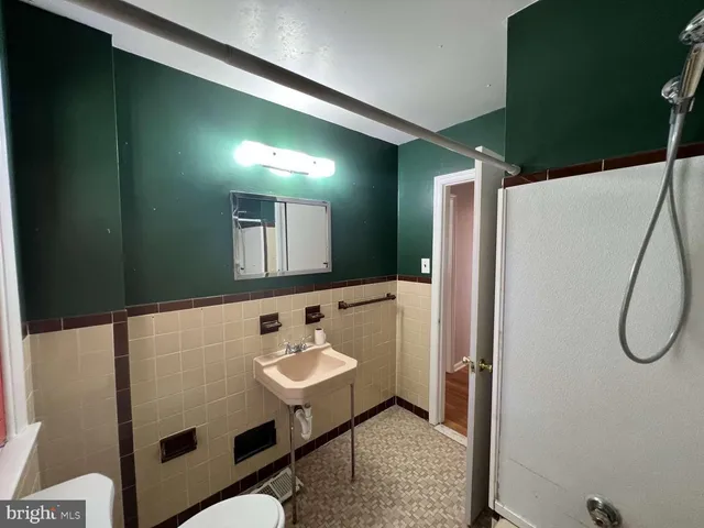 a bathroom with a sink and mirror