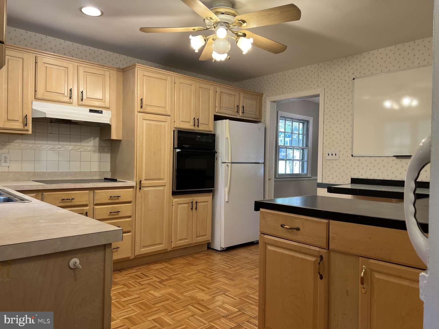 41 Fremont Road Newark, DE 19711 - Photo 3 of 25 a kitchen with stainless steel appliances a refrigerator sink and cabinets