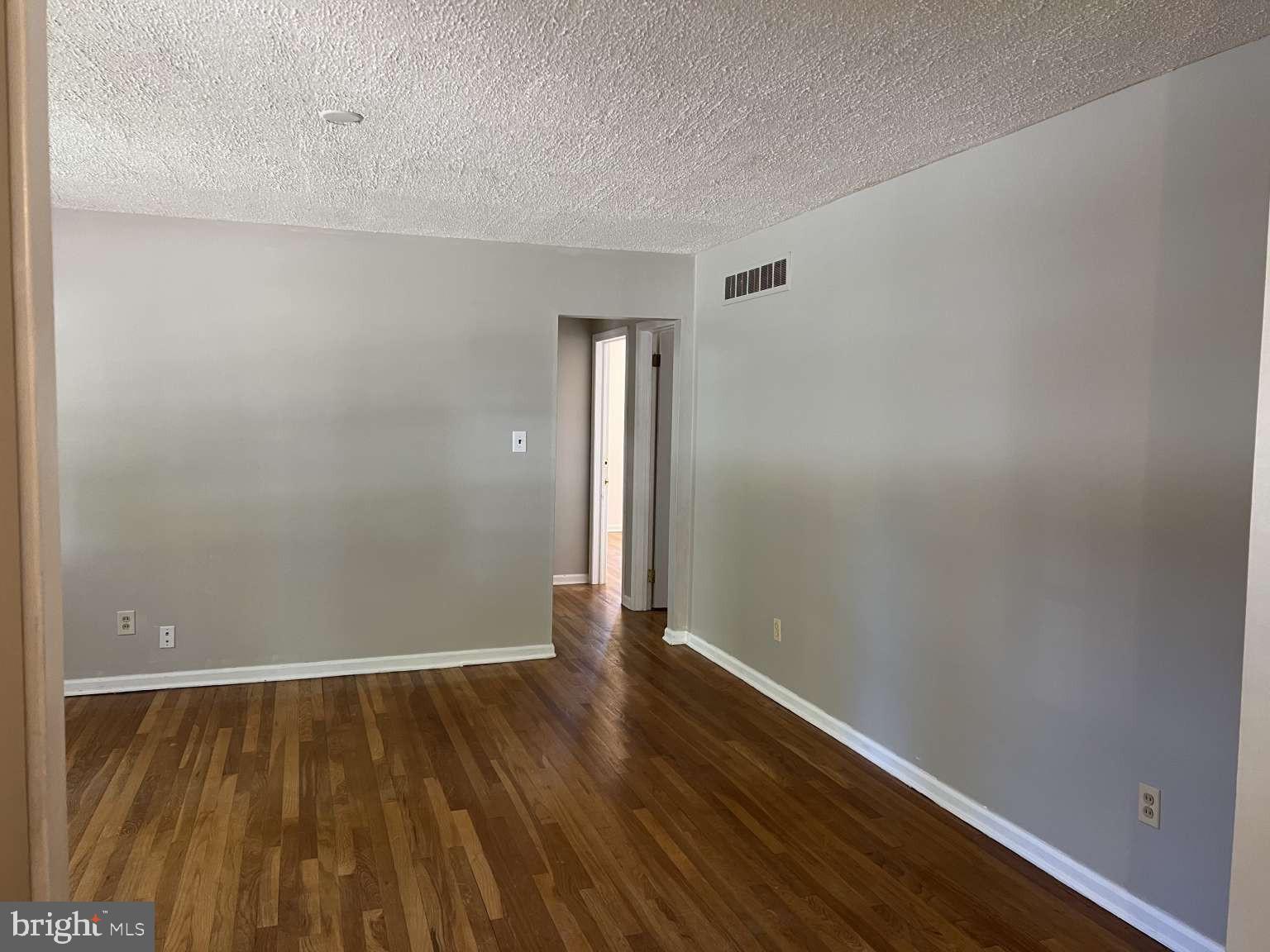 41 Fremont Road Newark, DE 19711 - Photo 6 of 25 a view of an empty room with wooden floor