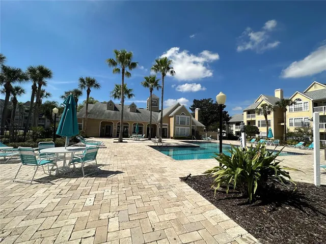 a view of a backyard with sitting area