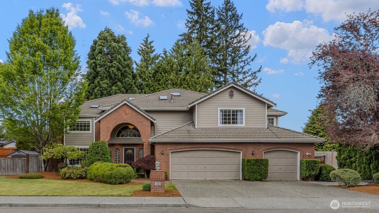 2323 241st Street Southeast Bothell, WA 98021 - Photo 1 of 40 a front view of a house with a garden