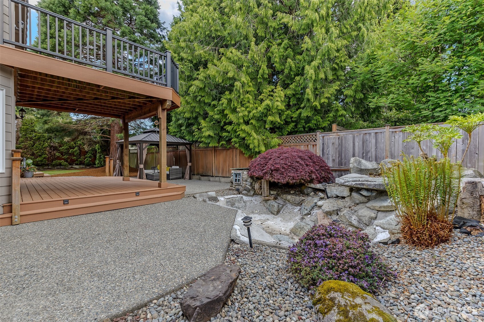 2323 241st Street Southeast Bothell, WA 98021 - Photo 38 of 40 a backyard of a house with barbeque oven and outdoor seating