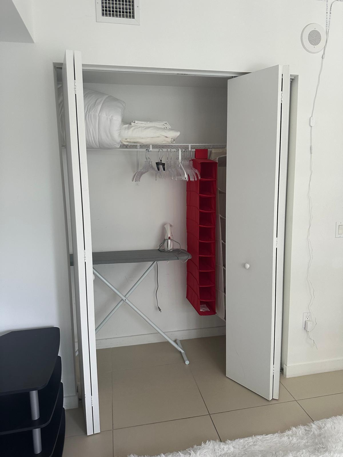 31 Southeast 6th Street, Unit 602 Miami, FL 33131 - Photo 16 of 39 a view of walk in closet with empty racks