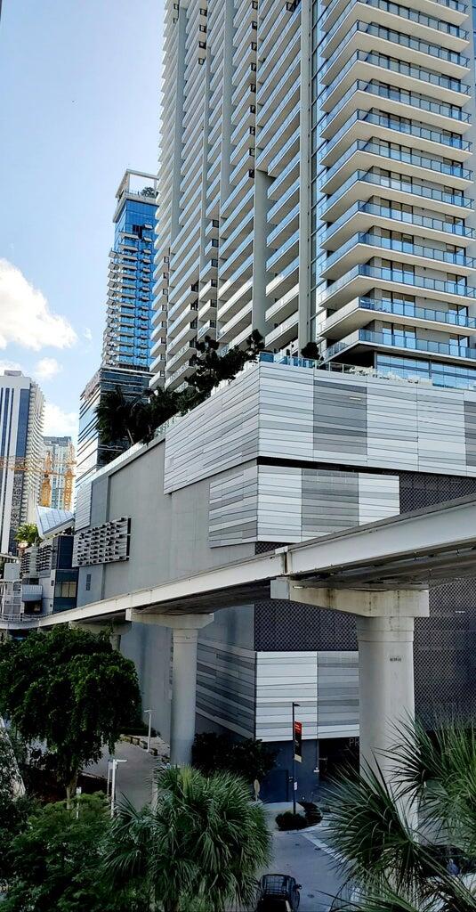 31 Southeast 6th Street, Unit 602 Miami, FL 33131 - Photo 19 of 39 a front view of a building with garden