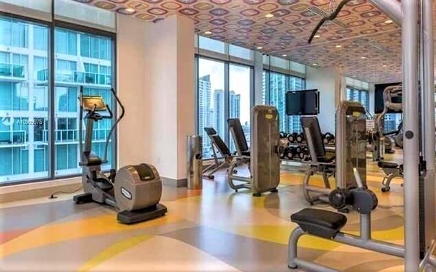 31 Southeast 6th Street, Unit 602 Miami, FL 33131 - Photo 24 of 39 a view of a room with gym equipment