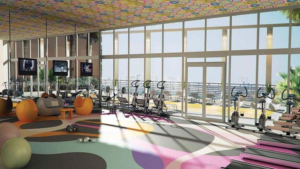 31 Southeast 6th Street, Unit 602 Miami, FL 33131 - Photo 26 of 39 a living room filled with furniture and floor to ceiling windows