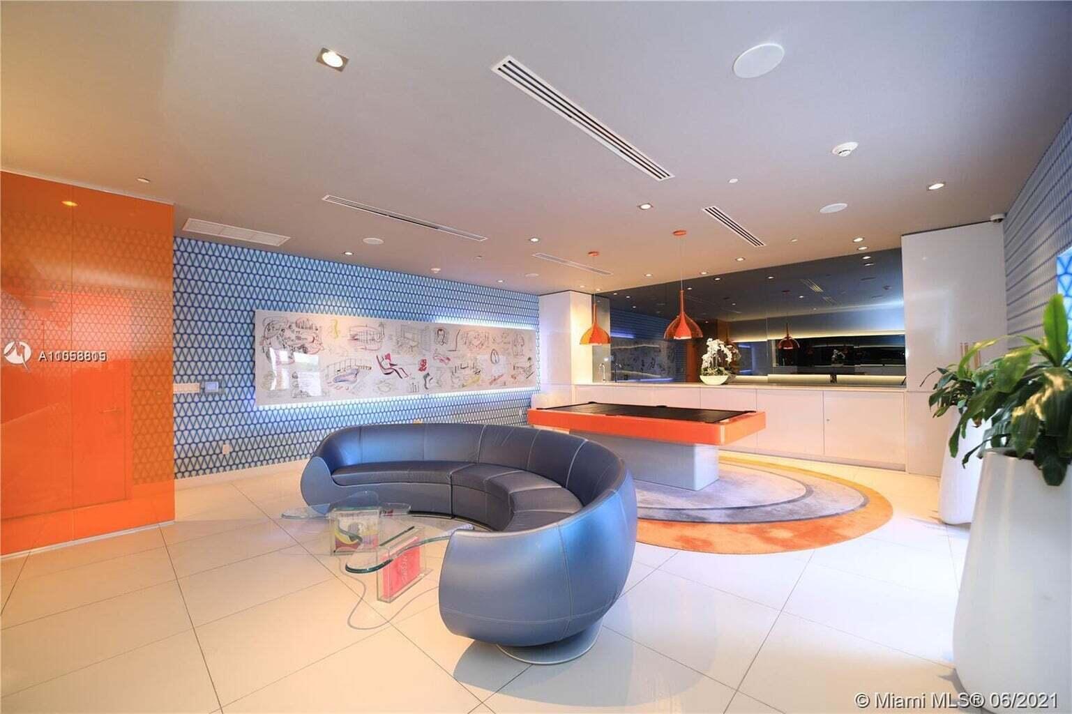 31 Southeast 6th Street, Unit 602 Miami, FL 33131 - Photo 28 of 39 a kitchen with stainless steel appliances granite countertop a sink and a stove