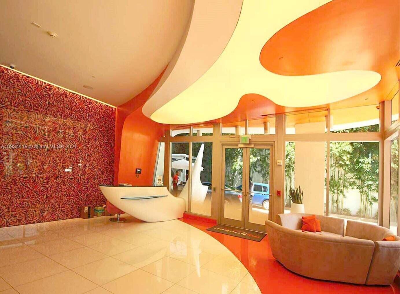 31 Southeast 6th Street, Unit 602 Miami, FL 33131 - Photo 34 of 39 a living room with furniture and a large window